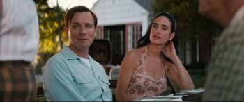 Movie still from “American Pastoral” (2016), directed by Ewan McGregor – A man and a woman sitting next to each other; Close Up shot, Low angle
