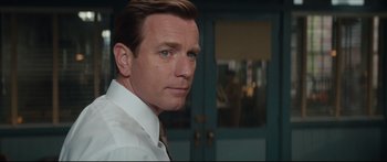 Movie still from “American Pastoral” (2016), directed by Ewan McGregor – A person wearing a shirt and tie; Close Up shot, Over the shoulder angle