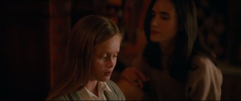 Movie still from “American Pastoral” (2016), directed by Ewan McGregor – A young girl sitting in front of a woman; Close Up shot, Over the shoulder angle