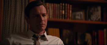 Movie still from “American Pastoral” (2016), directed by Ewan McGregor – A person wearing a shirt and tie; Close Up shot, Over the shoulder angle