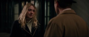 Movie still from “American Pastoral” (2016), directed by Ewan McGregor – A woman standing in front of a man in front of a mirror; Close Up shot, Over the shoulder angle