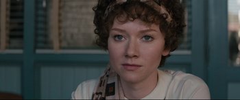 Movie still from “American Pastoral” (2016), directed by Ewan McGregor – A person wearing a scarf; Close Up shot, Over the shoulder angle