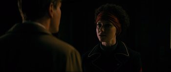 Movie still from “American Pastoral” (2016), directed by Ewan McGregor – A man and a woman are standing in the dark; Close Up shot, Over the shoulder angle