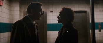 Movie still from “American Pastoral” (2016), directed by Ewan McGregor – A man and a woman face to face in a room; Medium shot, Low angle