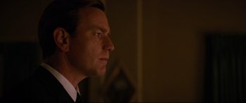Movie still from “American Pastoral” (2016), directed by Ewan McGregor – A person looking to his left; Close Up shot, Over the shoulder angle
