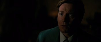 Movie still from “American Pastoral” (2016), directed by Ewan McGregor – A person wearing a suit and tie; Close Up shot, Over the shoulder angle