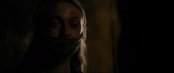 Movie still from “American Pastoral” (2016), directed by Ewan McGregor – A woman with a bandage around her mouth; Close Up shot, Over the shoulder angle