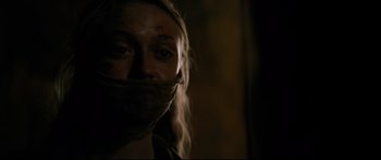 Movie still from “American Pastoral” (2016), directed by Ewan McGregor – A woman with a bandage around her mouth; Close Up shot, Low angle