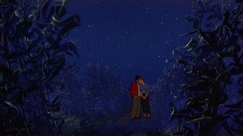 Movie still from “American Pop” (1981), directed by Ralph Bakshi – Two people standing in the dark under a night sky; Wide shot, Low angle
