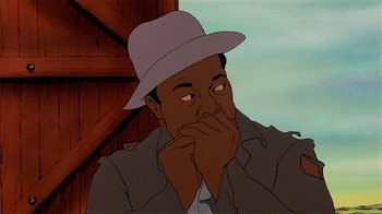 Movie still from “American Pop” (1981), directed by Ralph Bakshi – An animated man with a hat is sitting in front of a wooden wall; Close Up shot, Low angle