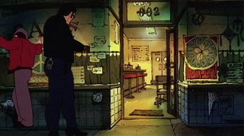 Movie still from “American Pop” (1981), directed by Ralph Bakshi – A man standing in front of a counter in a store; Wide shot, High angle