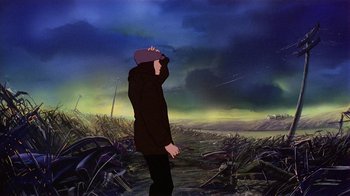 Movie still from “American Pop” (1981), directed by Ralph Bakshi – A man standing in a field with his head in the air; Wide shot, Low angle