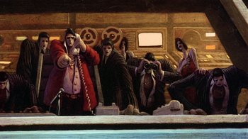 Movie still from “American Pop” (1981), directed by Ralph Bakshi – A group of people sitting on top of a train; Wide shot, Low angle