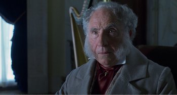 Movie still from “Amistad” (1997), directed by Steven Spielberg – An old man with a beard and a white beard; Close Up shot, Over the shoulder angle
