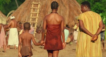Movie still from “Amistad” (1997), directed by Steven Spielberg – A woman and a child holding hands in a desert; Wide shot, Low angle