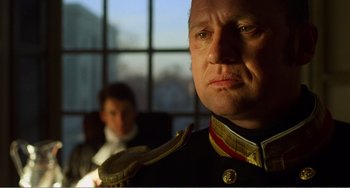 Movie still from “Amistad” (1997), directed by Steven Spielberg – A person wearing a military uniform; Close Up shot, Low angle