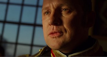Movie still from “Amistad” (1997), directed by Steven Spielberg – A person wearing a military uniform; Close Up shot, Low angle