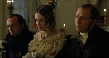 Movie still from “Amistad” (1997), directed by Steven Spielberg – A man and a woman sitting next to each other; Close Up shot, Over the shoulder angle