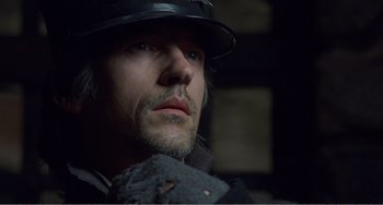 Movie still from “Amistad” (1997), directed by Steven Spielberg – A person wearing a hat; Close Up shot, Low angle