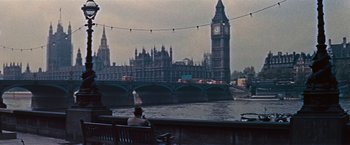 Movie still from “An Affair to Remember” (1957), directed by Leo McCarey – A man sitting on a bench near a river; Extreme Wide shot, Low angle