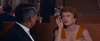Movie still from “An Affair to Remember” (1957), directed by Leo McCarey – An older man and a young woman sitting in front of each other; Close Up shot, Over the shoulder angle