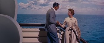 Movie still from “An Affair to Remember” (1957), directed by Leo McCarey – A man and a woman holding hands on a boat; Medium shot, Low angle