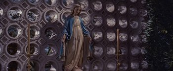 Movie still from “An Affair to Remember” (1957), directed by Leo McCarey – A statue of a virgin mary in front of a wall of mirrors; Wide shot, Low angle