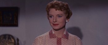 Movie still from “An Affair to Remember” (1957), directed by Leo McCarey – An older woman in a polka dot shirt and pink shirt; Close Up shot, Low angle