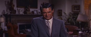 Movie still from “An Affair to Remember” (1957), directed by Leo McCarey – A person wearing a suit and tie; Close Up shot, Over the shoulder angle