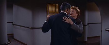 Movie still from “An Affair to Remember” (1957), directed by Leo McCarey – An older man and a younger woman dancing together; Medium shot, Low angle