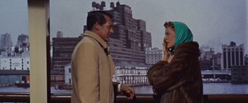 Movie still from “An Affair to Remember” (1957), directed by Leo McCarey – A man and a woman standing next to each other on a bridge; Medium shot, Over the shoulder angle