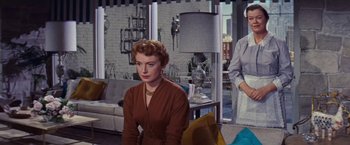 Movie still from “An Affair to Remember” (1957), directed by Leo McCarey – A woman sitting on a chair in front of a window; Medium shot, Low angle