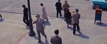 Movie still from “An Affair to Remember” (1957), directed by Leo McCarey – A group of people standing on a sidewalk; Wide shot, High angle