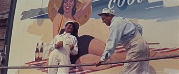 Movie still from “An Affair to Remember” (1957), directed by Leo McCarey – A couple of men standing next to each other; Medium shot, Low angle