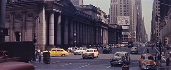Movie still from “An Affair to Remember” (1957), directed by Leo McCarey – A street scene with cars driving down the road; Extreme Wide shot, High angle