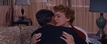Movie still from “An Affair to Remember” (1957), directed by Leo McCarey – A man and a woman embracing each other; Close Up shot, Over the shoulder angle