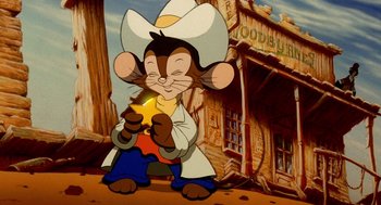 Movie still from “An American Tail: Fievel Goes West” (1991), directed by Simon Wells – A cartoon of a mouse holding a piece of fruit; Medium shot, High angle