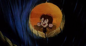 Movie still from “An American Tail: Fievel Goes West” (1991), directed by Simon Wells – A painting of a cartoon character in a cave; Close Up shot, High angle