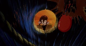 Movie still from “An American Tail: Fievel Goes West” (1991), directed by Simon Wells – An animated picture of a monkey in a cave; Medium shot, High angle