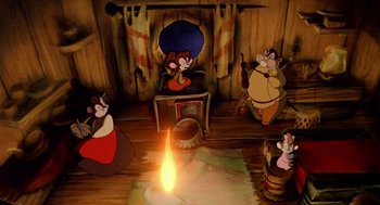 Movie still from “An American Tail: Fievel Goes West” (1991), directed by Simon Wells – A group of cartoon characters sitting around a fire pit; Wide shot, High angle