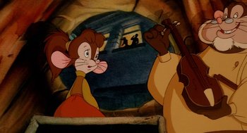 Movie still from “An American Tail: Fievel Goes West” (1991), directed by Simon Wells – A picture of a mouse and a man playing a violin; Close Up shot, High angle