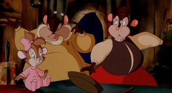 Movie still from “An American Tail: Fievel Goes West” (1991), directed by Simon Wells – A group of cartoon characters sitting in front of a cave; Medium shot, High angle