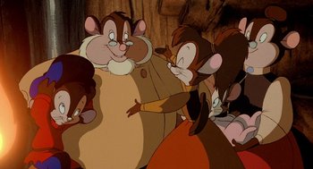 Movie still from “An American Tail: Fievel Goes West” (1991), directed by Simon Wells – A group of people that are standing up in a room together; Medium shot, High angle
