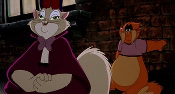 Movie still from “An American Tail: Fievel Goes West” (1991), directed by Simon Wells – Two cartoon cats are standing next to each other; Medium shot, Over the shoulder angle