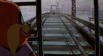 Movie still from “An American Tail: Fievel Goes West” (1991), directed by Simon Wells – A scene of a train track with a person sitting on it; Wide shot, Low angle