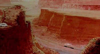Movie still from “An American Tail: Fievel Goes West” (1991), directed by Simon Wells – A painting of a canyon with red rock walls; Extreme Wide shot, Low angle