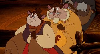 Movie still from “An American Tail: Fievel Goes West” (1991), directed by Simon Wells – A couple of cartoon characters standing next to each other; Medium shot, Over the shoulder angle