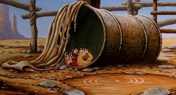 Movie still from “An American Tail: Fievel Goes West” (1991), directed by Simon Wells – A painting of the flintstones in the flintstones cartoon; Wide shot, High angle