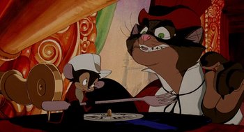 Movie still from “An American Tail: Fievel Goes West” (1991), directed by Simon Wells – A mouse and a cat are sitting in front of a plate; Medium shot, Over the shoulder angle