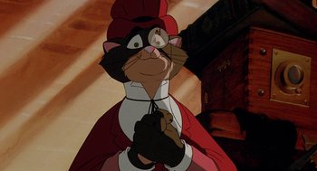 Movie still from “An American Tail: Fievel Goes West” (1991), directed by Simon Wells – A cat wearing a red outfit and a red hat; Close Up shot, Low angle